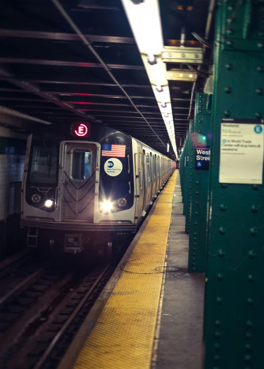 a metro train pulling into a subway station