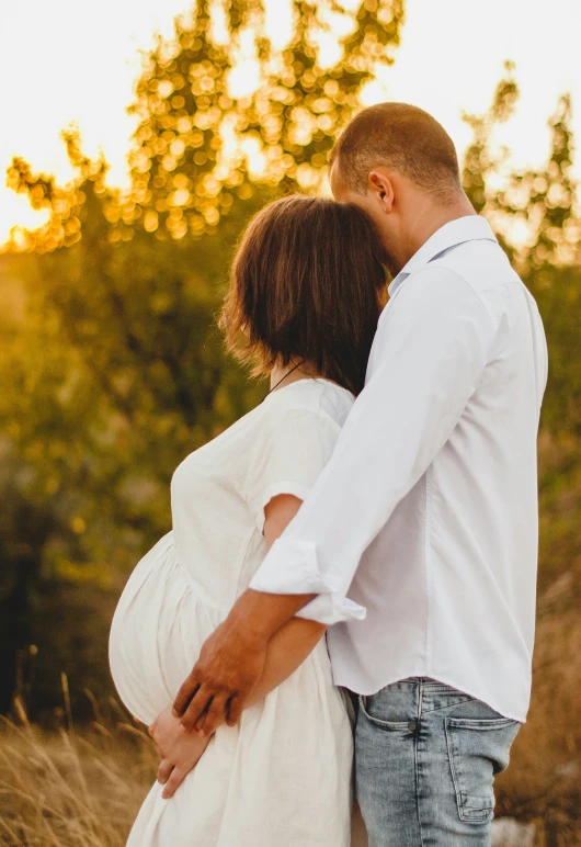 a man and woman emcing while looking into the distance