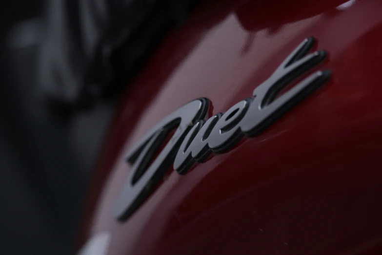 a close up view of the emblem and name on a motorcycle