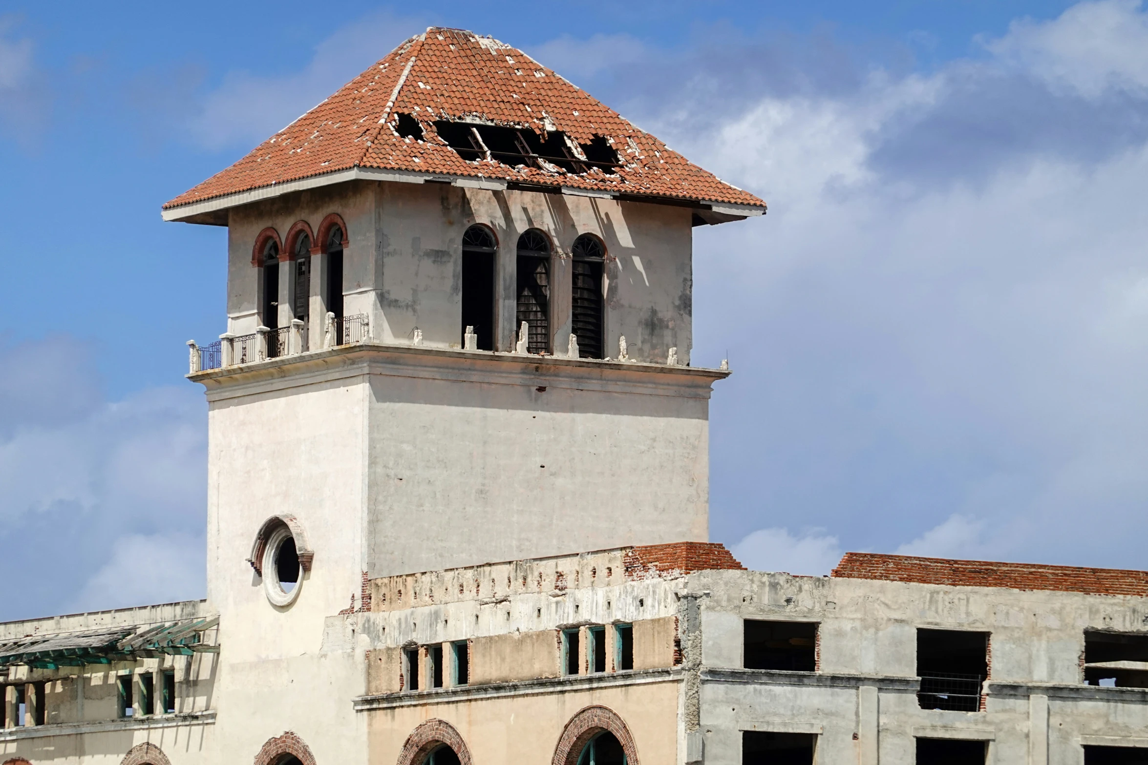 an old church steeple with three windows on top of the building