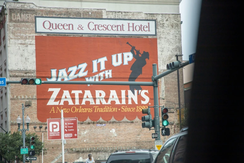 a sign advertises the musical duo in front of an old building