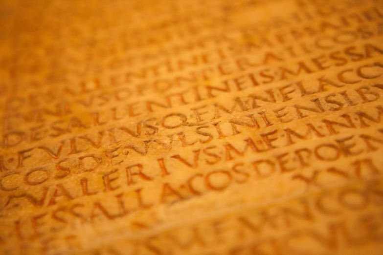 a close up of words written in various languages on a table