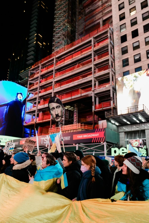 people on the street holding banners and flags