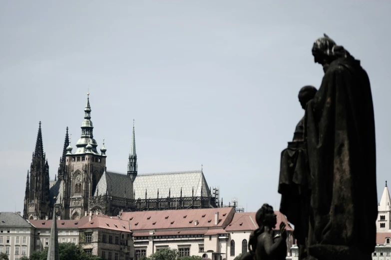 an statue sits in front of the building