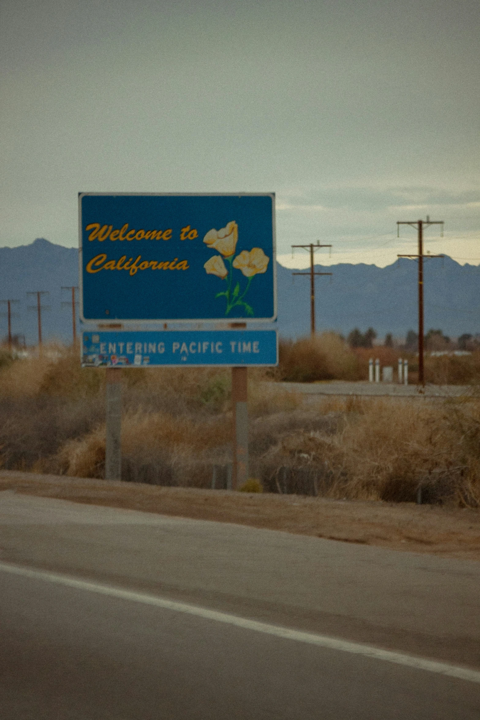 the welcome sign to california on a highway