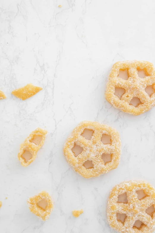 the cookies are on a table with orange peels