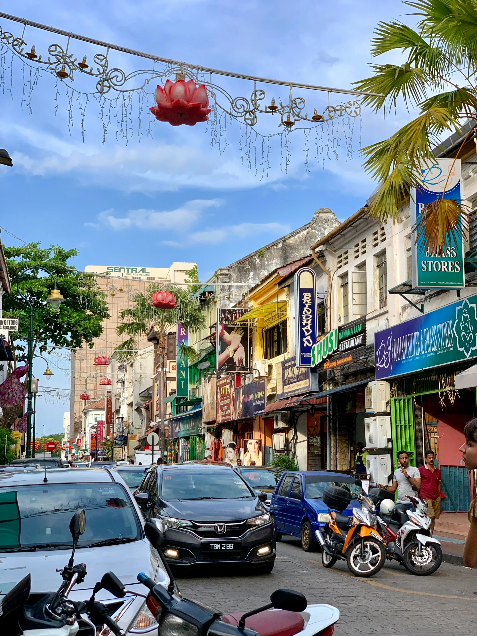 a street lined with buildings and parked cars