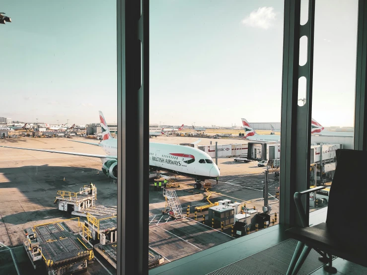 this window has a plane on the tarmac behind it