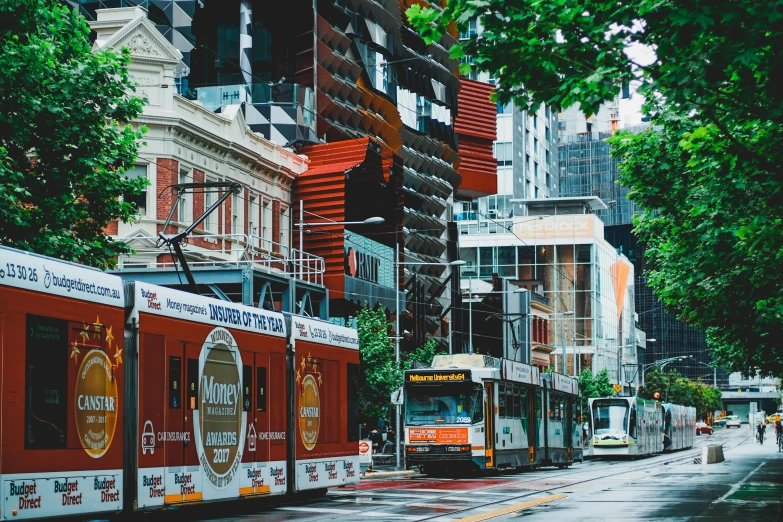 a trolley car is driving along a city street