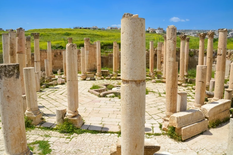 many very old cement pillars in a field