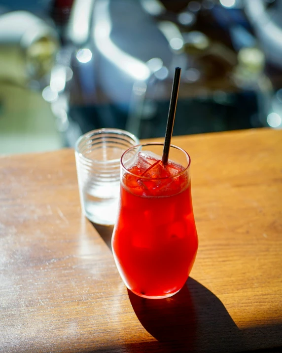 the drink is served with strawberries on the table