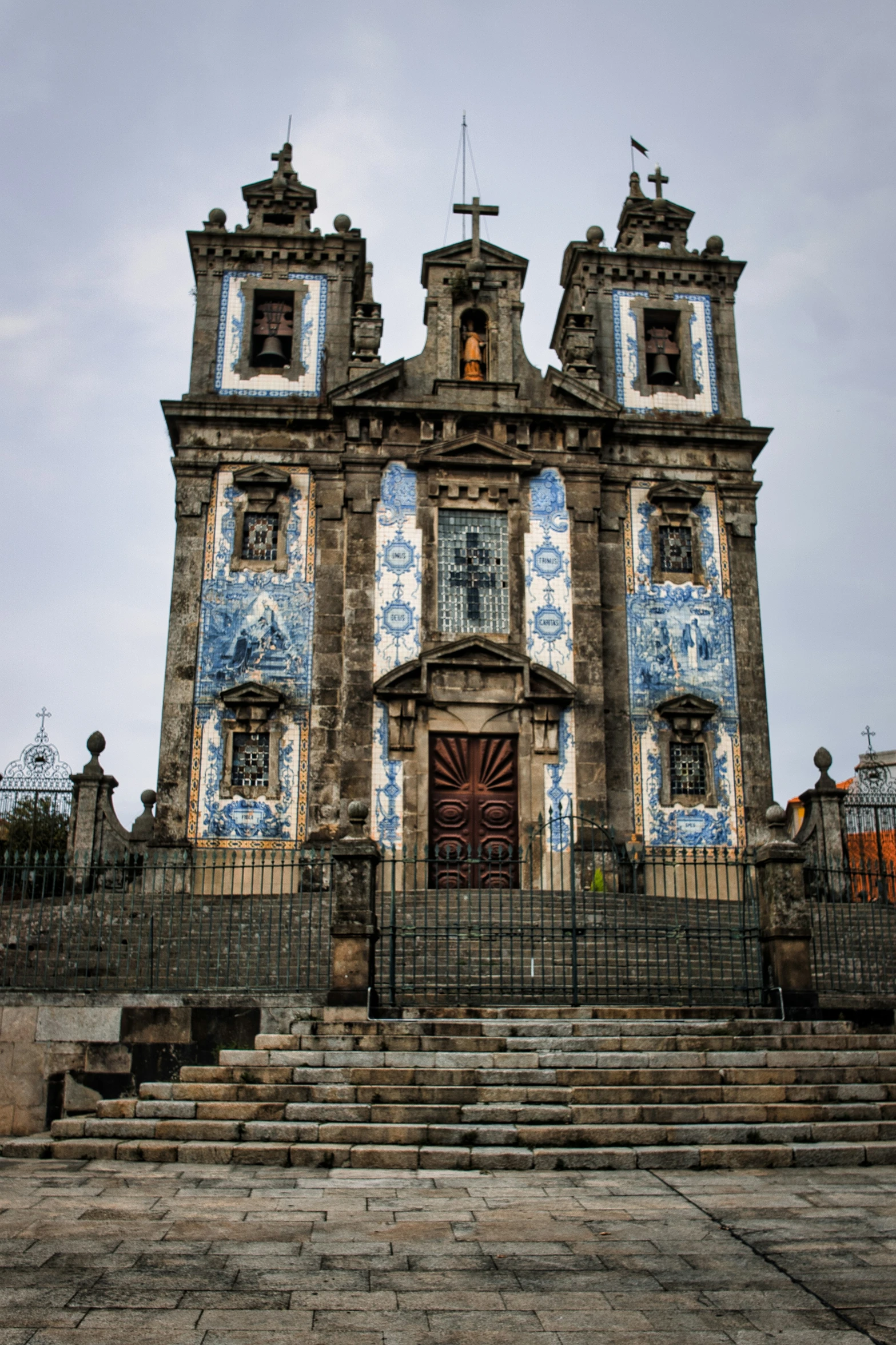 the old church has two towers with cross at the top