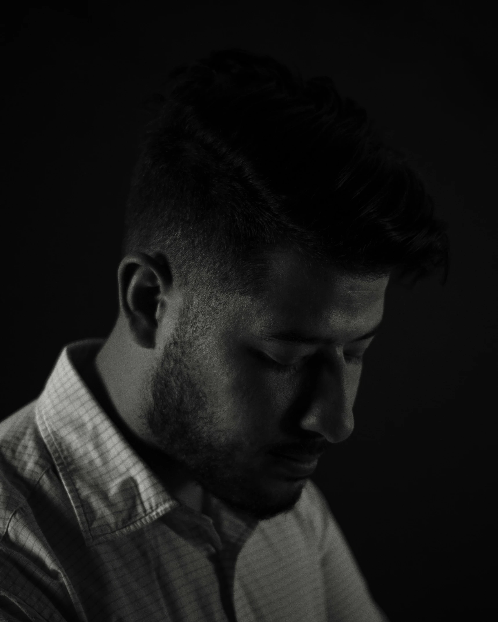 black and white pograph of a man in profile