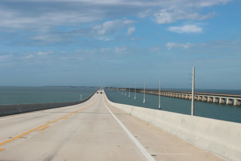 a view from a vehicle as it is passing on an ocean