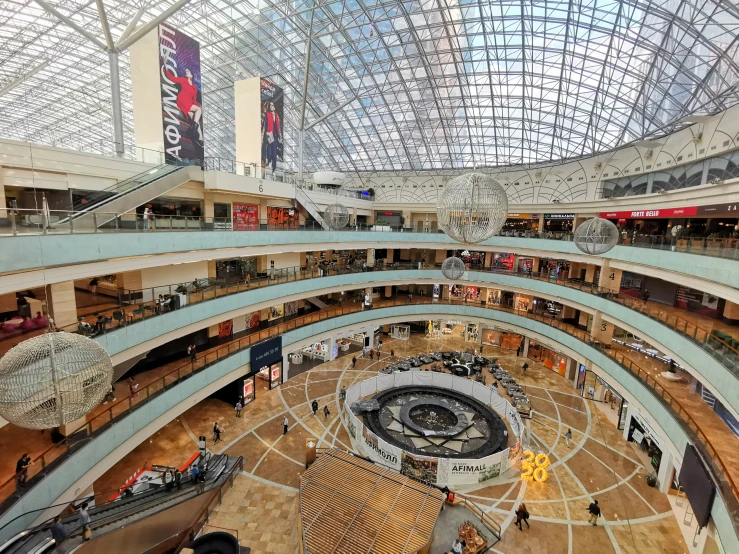 a large open mall with people standing around