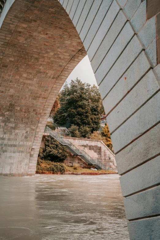 an overpass spanning a city river between two bridges