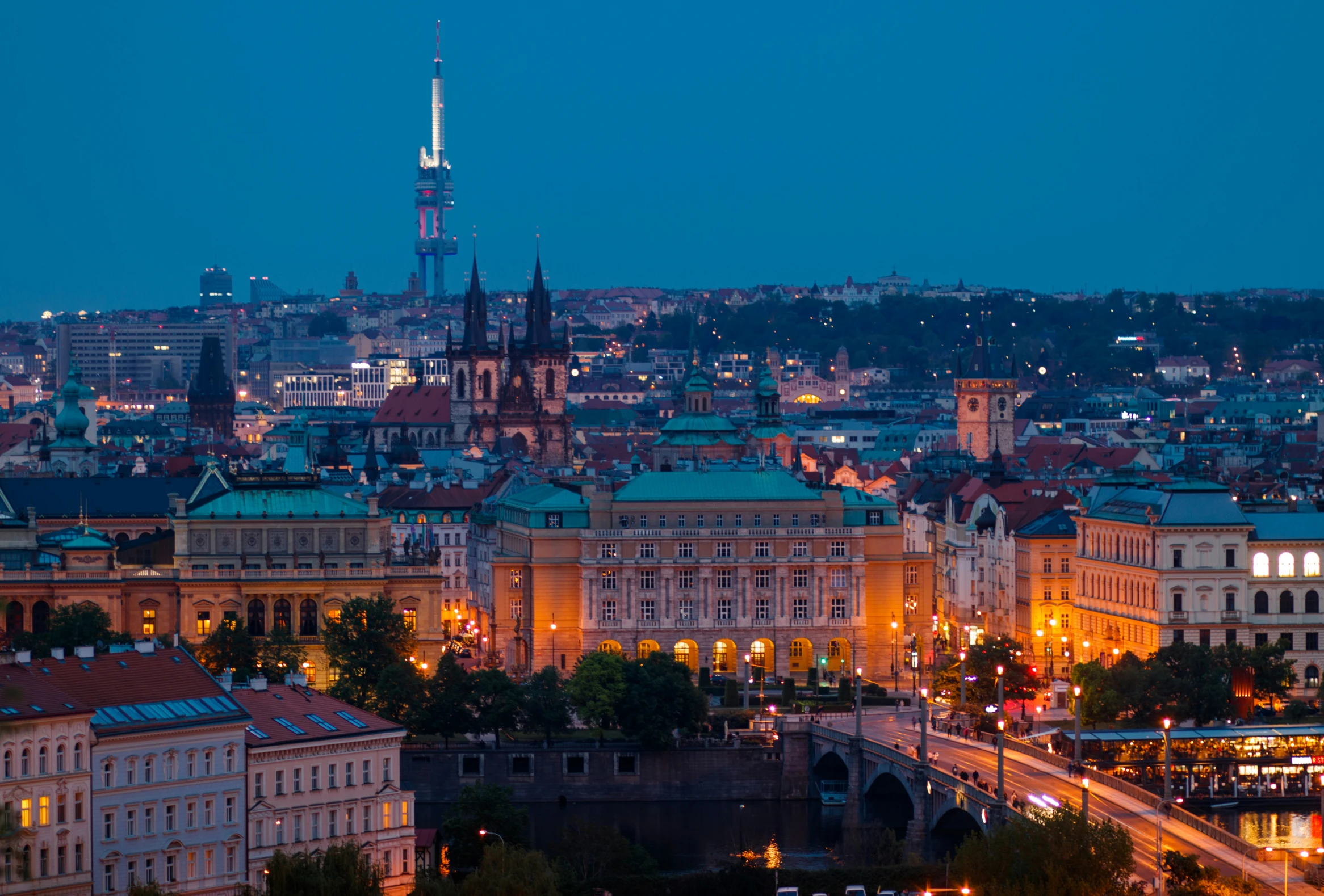 an urban scene with lights shining on a skyline