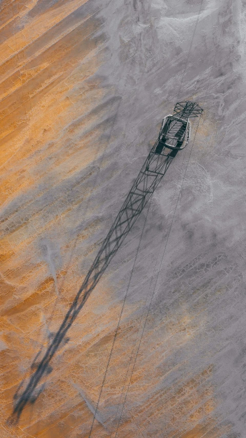 a tower in the middle of a sandy area