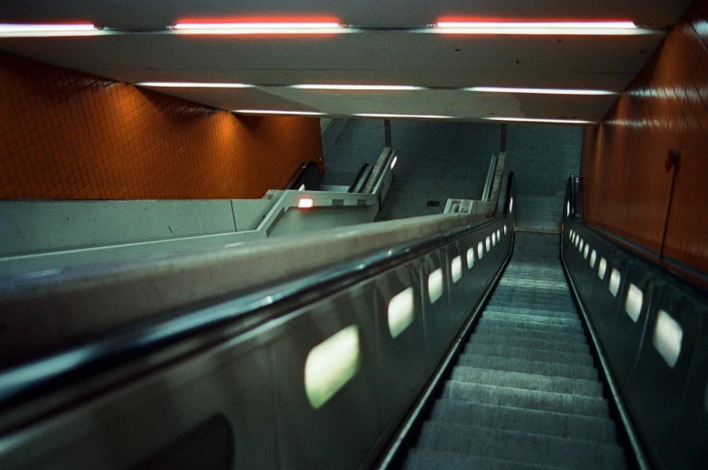 a train platform with several set of moving tracks