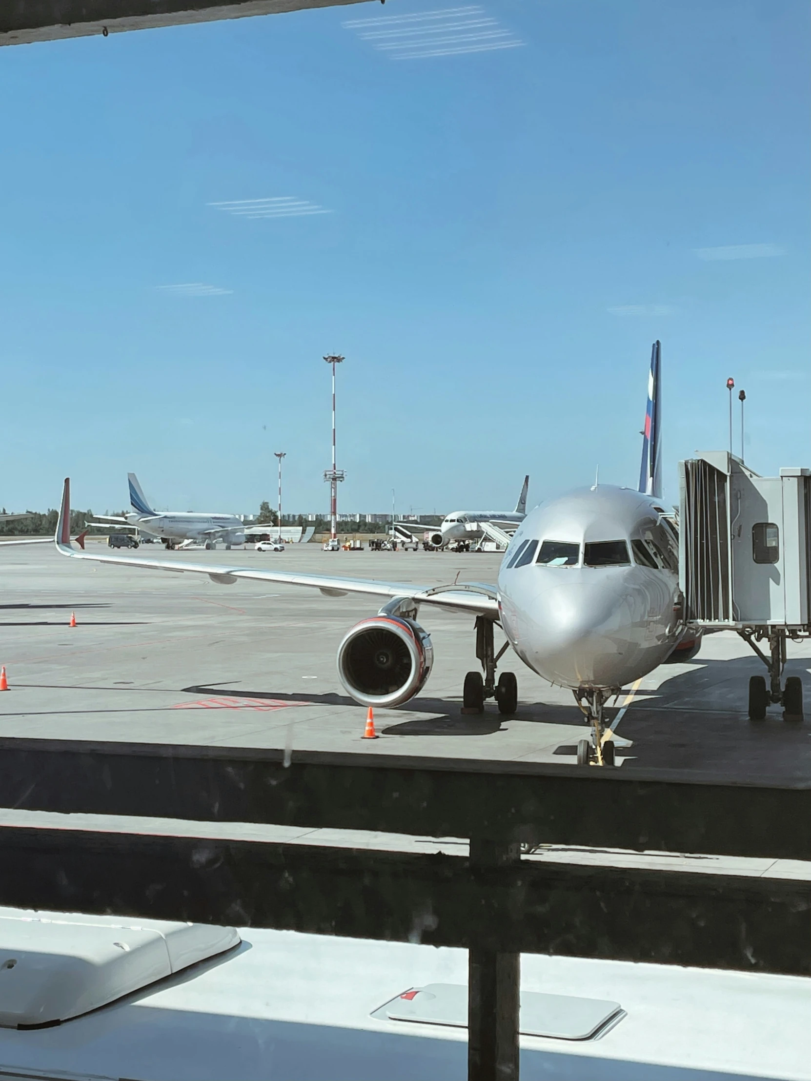 an airplane is parked next to the loading area