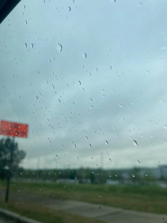 an image of rain on the windshield of a car