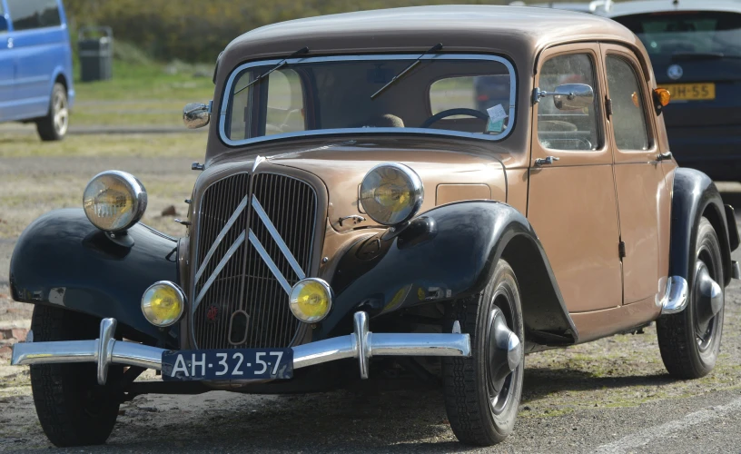 an old car that is sitting in the street