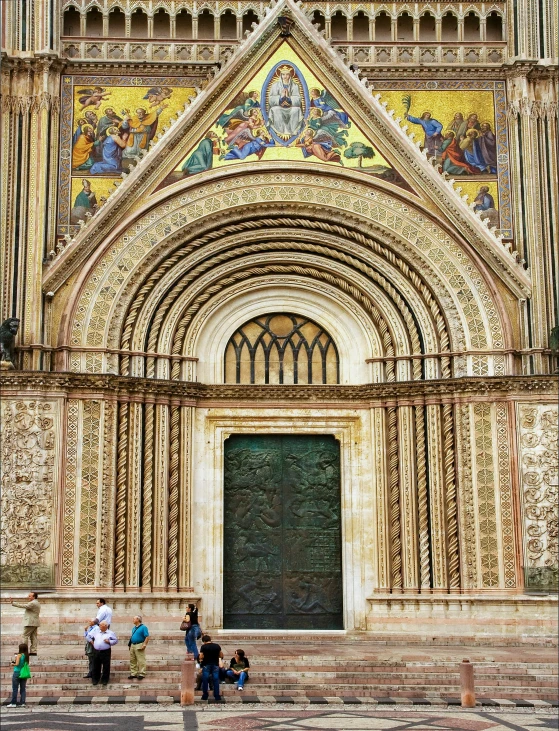 a group of people standing outside of an old building