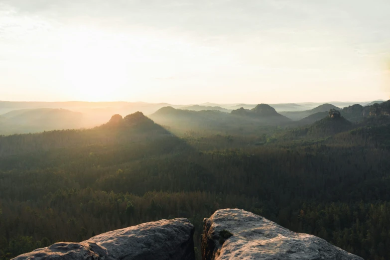 a rocky outcropping overlooking several mountains