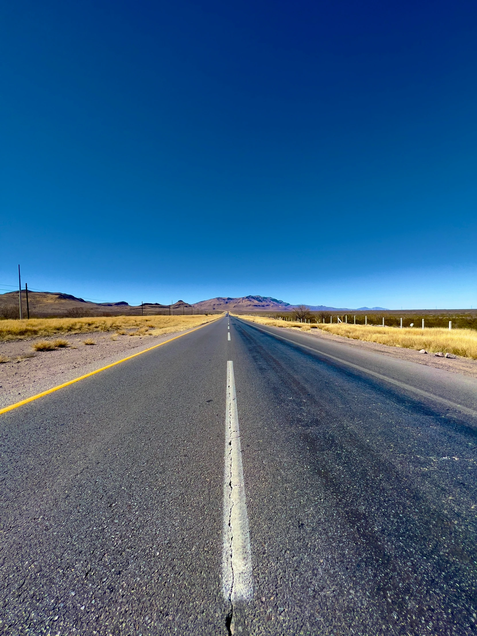 a road stretching into the distance on a sunny day