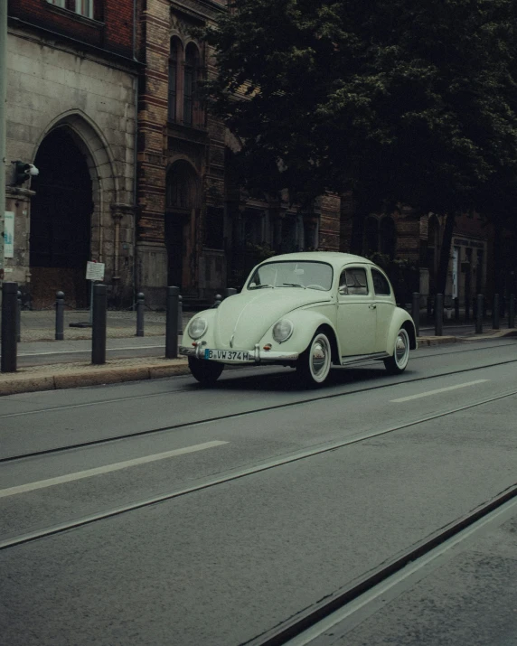 a car parked on a street next to a building