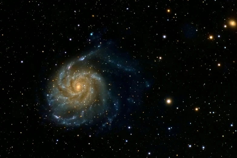 the large spiral galaxy is surrounded by stars