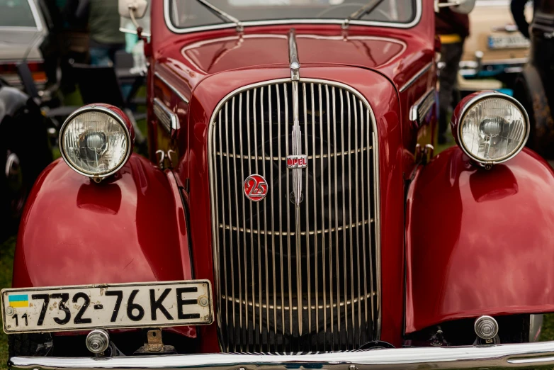 old time red car with the number plate 752 - 16ke