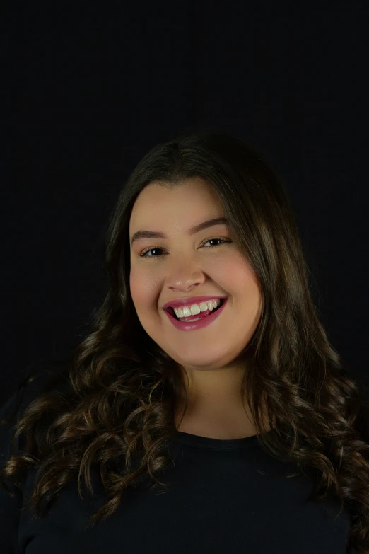 a young woman smiling with her mouth open