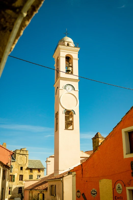 a tower of a building with a clock mounted on it