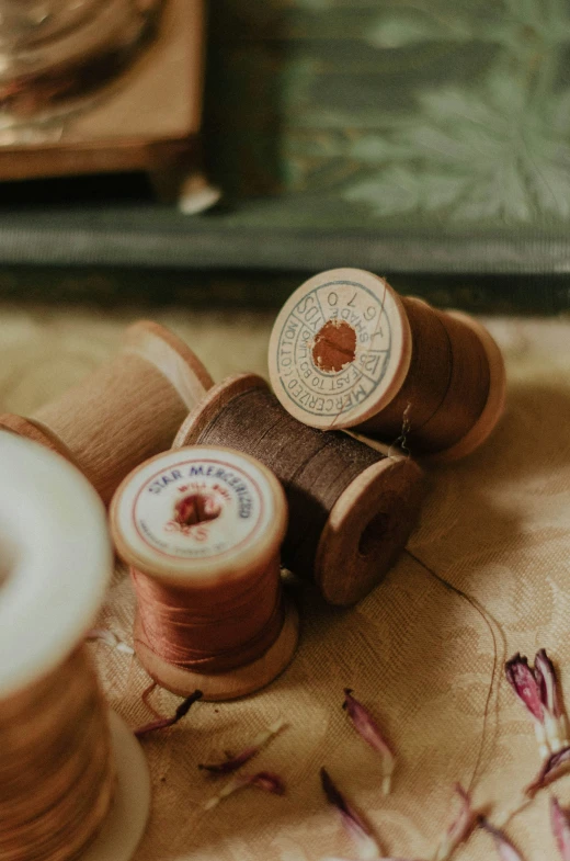 a spool of thread sitting on top of a table