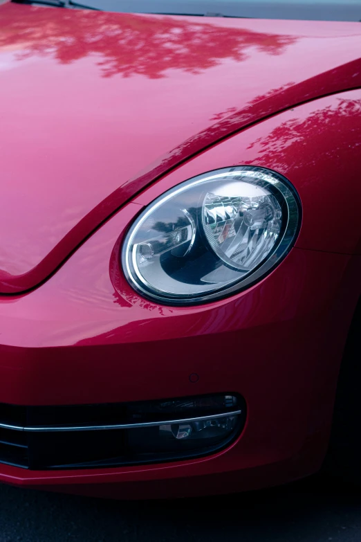 the front end of a red beetle