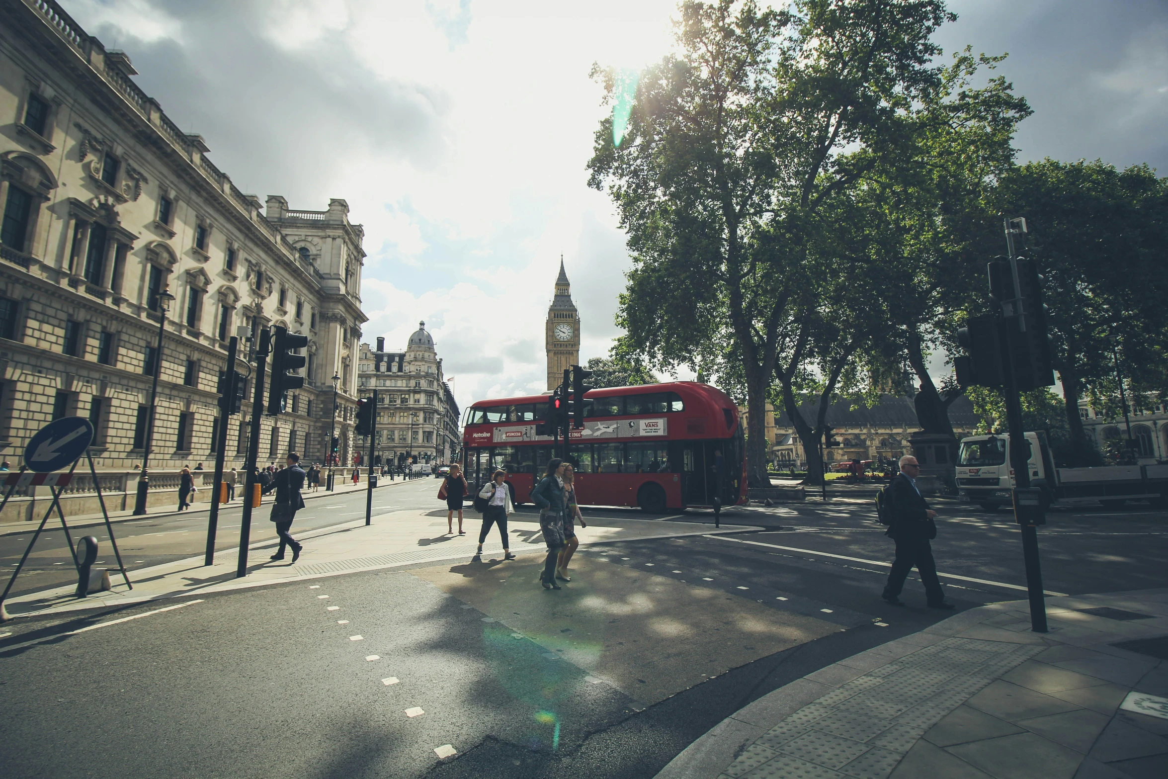 people walk and walk on the street in a city