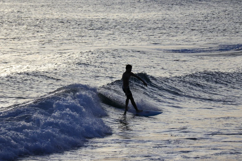 the surfer is riding a wave in the water