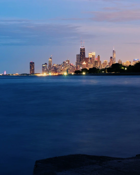 the large city is lit up at night