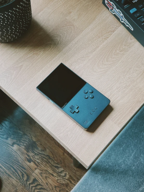 a table with an old video game controller on it