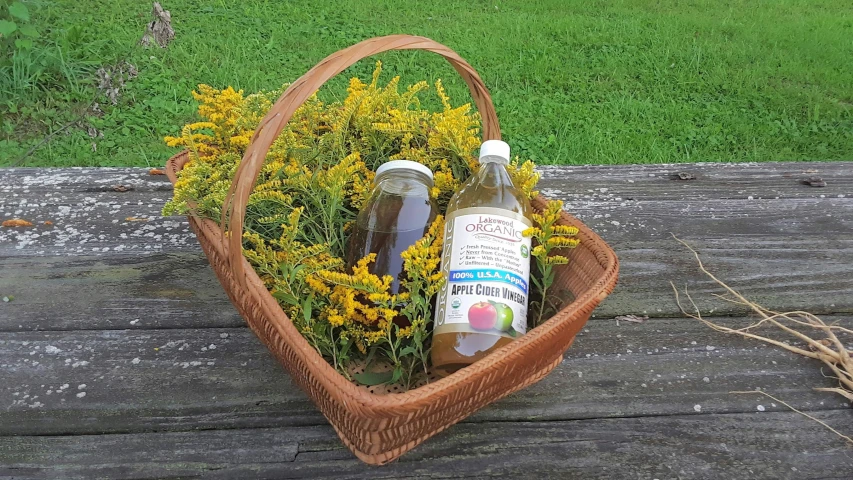 some bottles of alcohol sitting on a picnic table