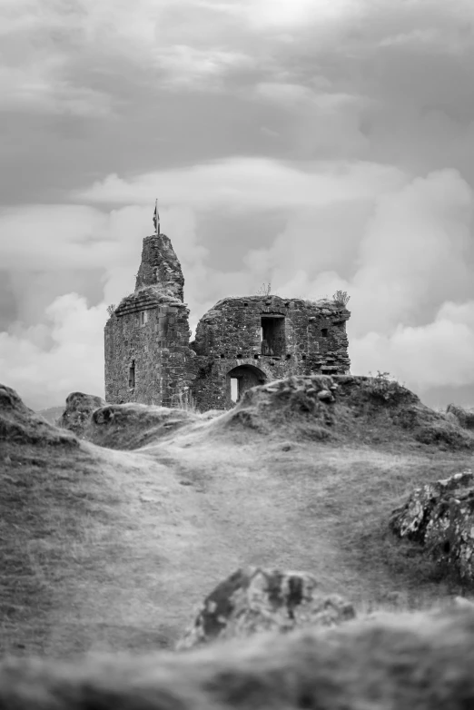 this old po shows a stone tower with an overhang