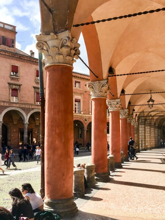 a building with columns and a sky background