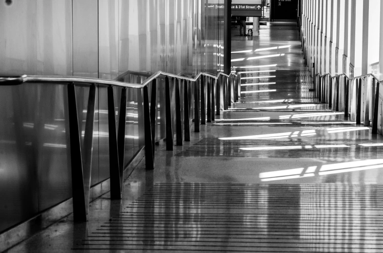 this long hallway leads to a bench in the middle