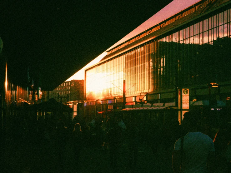 the outside of a building with people looking in the window