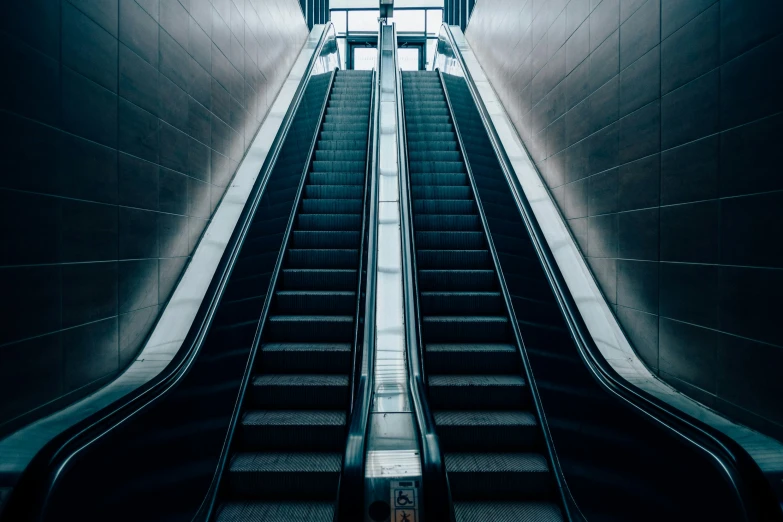 an escalator going up in an underground building