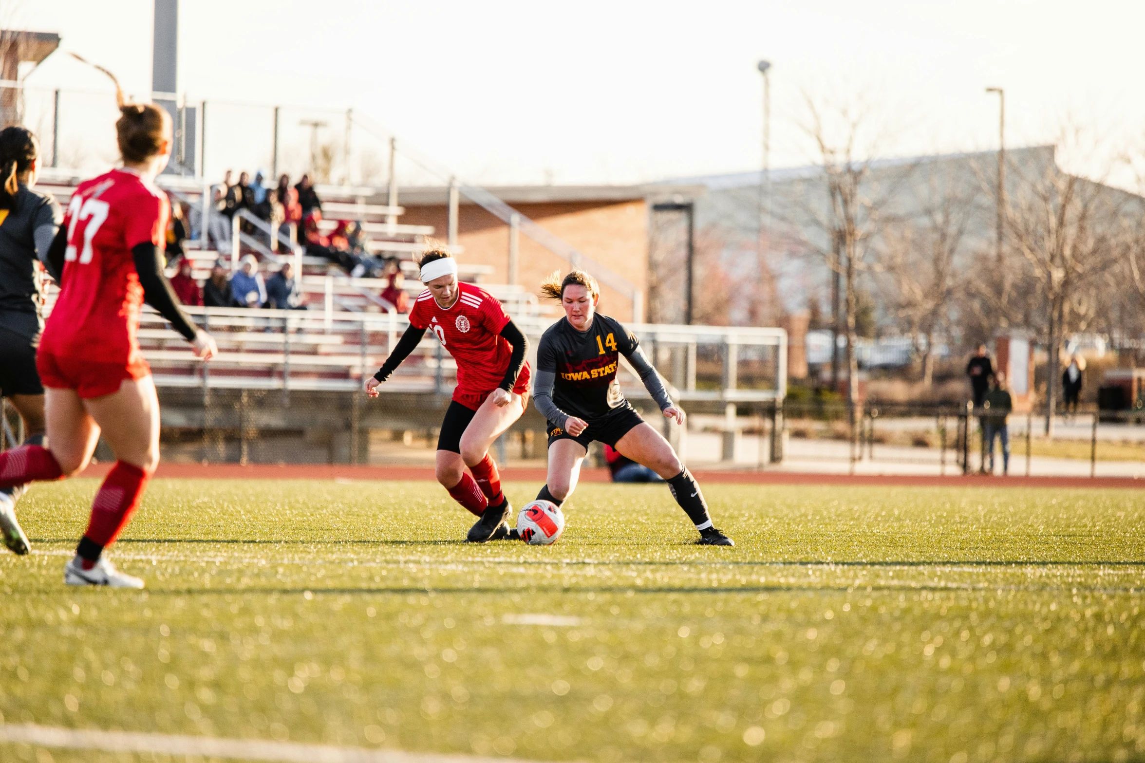 there are two women playing soccer on the field