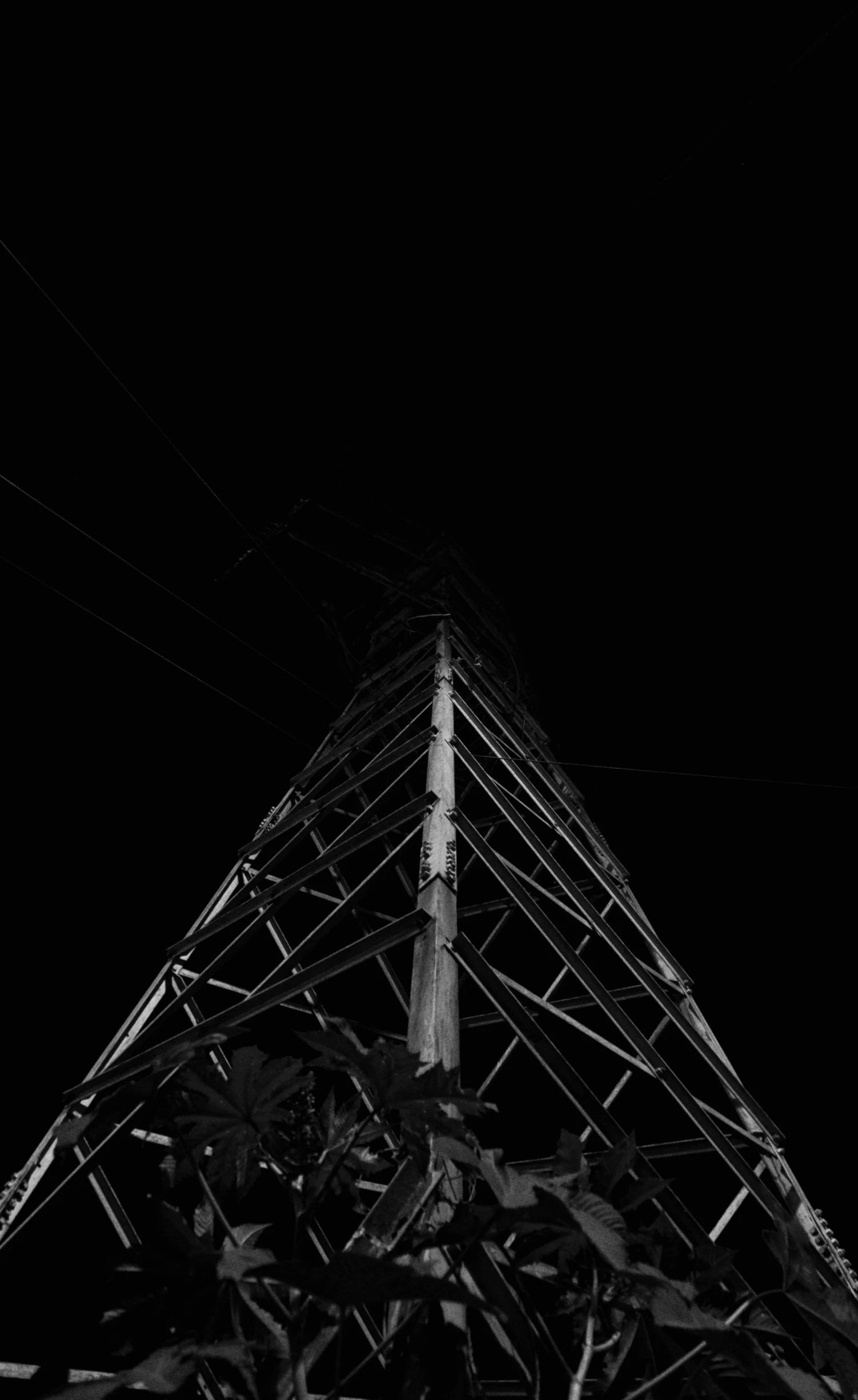 a black and white po of the top of an antenna tower