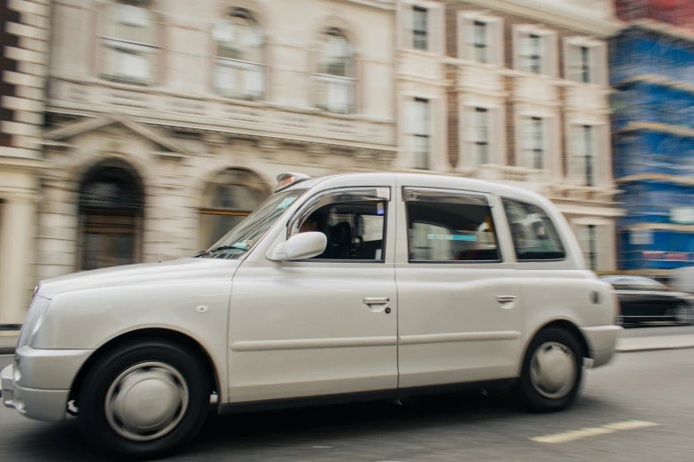 the cab is driving down the city street