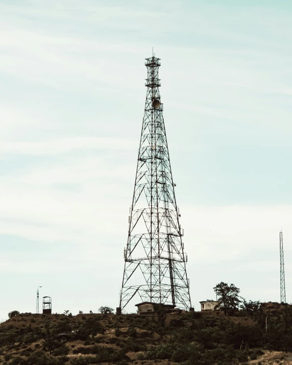 a view of a radio tower on top of a hill